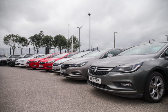 Used car dealership row of cars