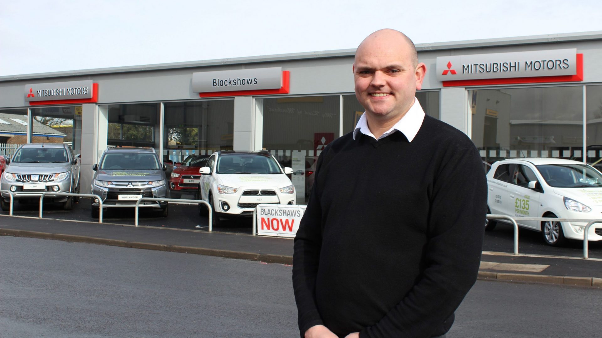 Will Blackshaw outside Mitsubishi dealership