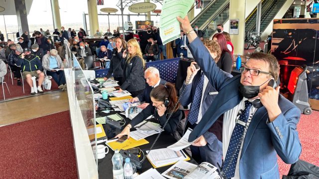 Auctioneer on the phone at Historics