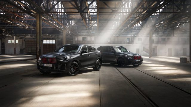 A pair of BMW SUVs parked side by side