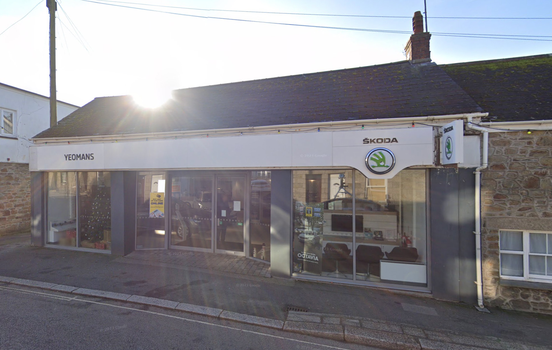 Car dealer group Yeomans sees pretax profit slide despite soaring